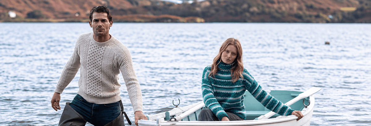 Couple in Fisherman Out Of Ireland Sweaters 