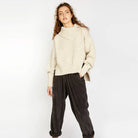 Woman wearing IDH Ireland's Eye Chalk Wilde Funnel Neck Sweater