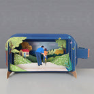 Dad and kid on bike in a message in a bottle diorama.