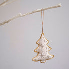 Square Christmas tree ornament hanging on branch