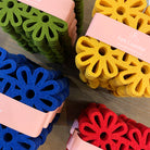 Closeup of colorful felt flower coasters